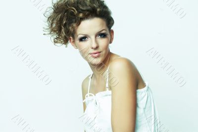 Woman sitting down on white background
