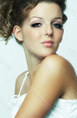 Woman sitting down on white background