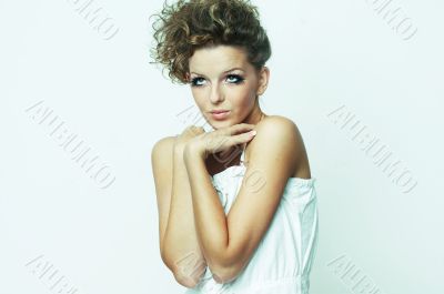 Woman sitting down on white background