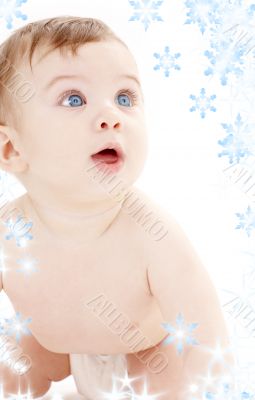 portrait of crawling baby boy looking up
