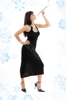 brunette in black dress with cigarette holder