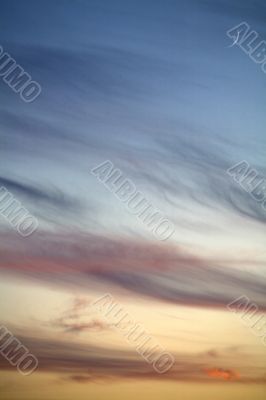 colored  evening sky with  cirrus clouds and the moon