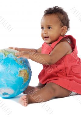 Baby girl with a globe of the world