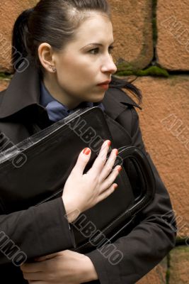 business woman holding portfolio