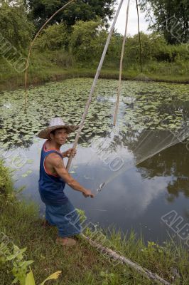Fisherman with stave, Asia