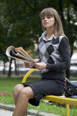 businesswoman with newspaper