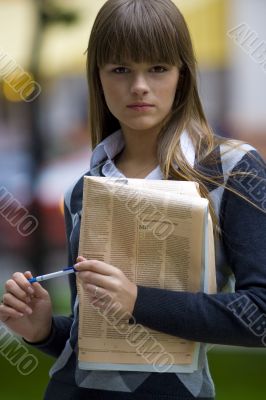 businesswoman with newspaper