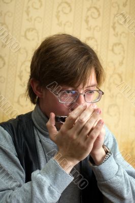 Playing the harmonica