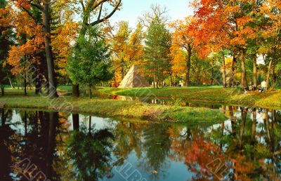 Autumn trees and pyramid in the park