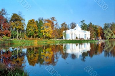 Classical building near the pond in autumn