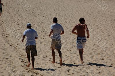 Three men jogging