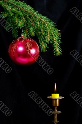  fir-tree  twig and red ball with candle