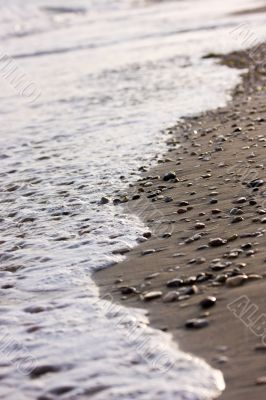 Pebble, sand and spindrift