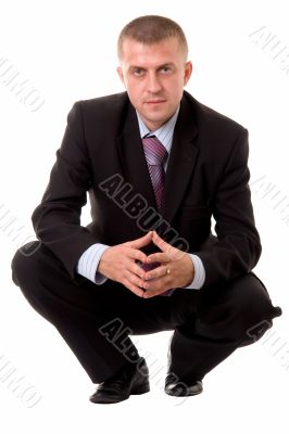 businessman sitting against white background