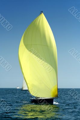 Sailing yacht with spinnaker in the wind