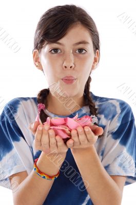 Cute girl blowing petals
