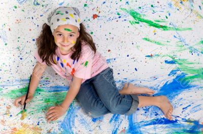 Girl playing with painting