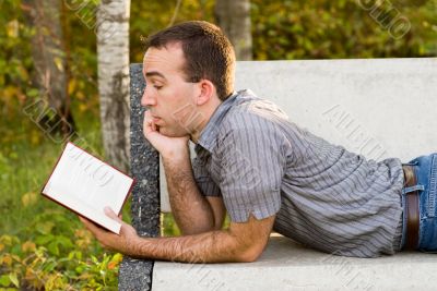 Man Reading A Novel