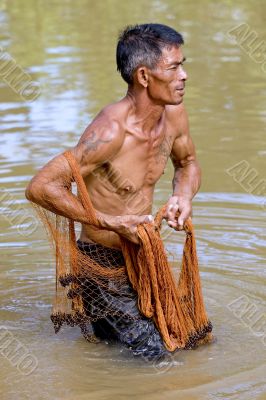 Fisherman of Thailand with throw net