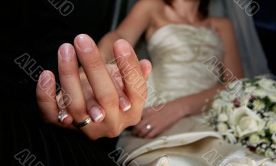 Hand of the groom and the bride