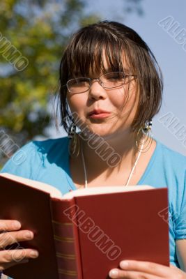 Girl Reading A Novel