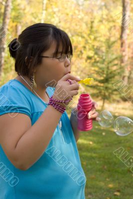 Girl Blowing Bubbles
