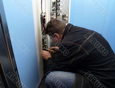 mechanic repairing button