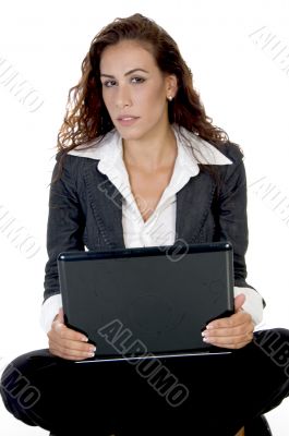 female holding laptop