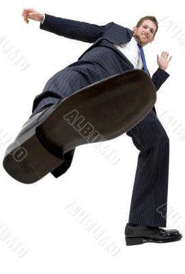 businessman kicking