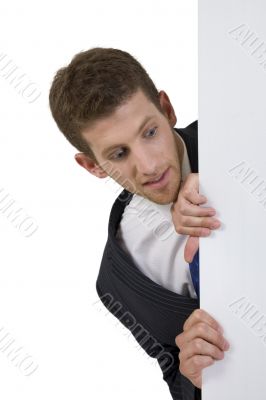 man peeping side white board