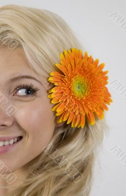 pretty model with flower in her hair