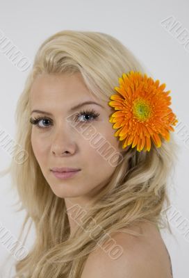 close up of young woman with flower