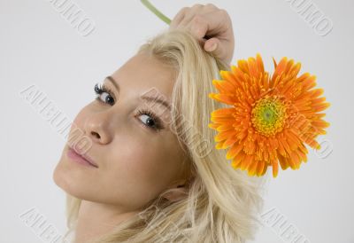 model with bright orange gerbera