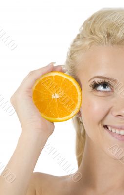 face of model with orange slice