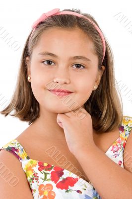 Adorable girl with flowered dress thinking