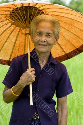 old Asian woman with parasol