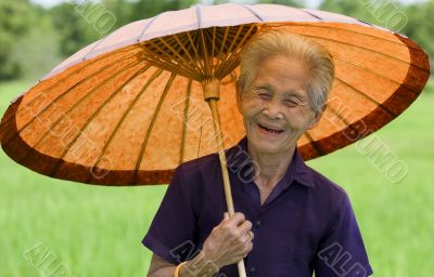 old Asian woman with parasol
