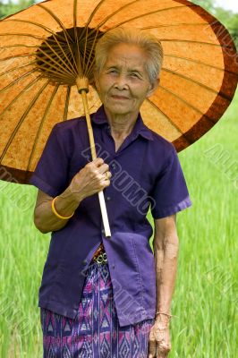 old Asian woman with parasol