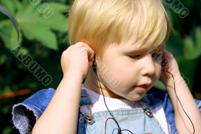 Child listens to music