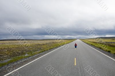 girl staying on highway