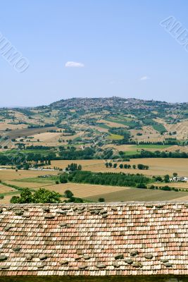 Landscape beyond a tiled roof