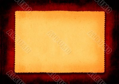 piece of yellowed paper on red