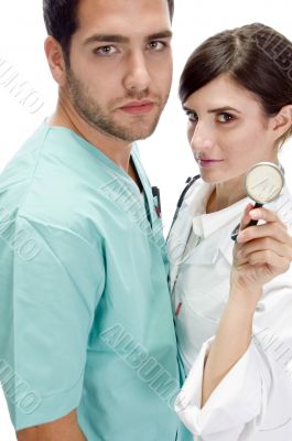 nurse standing with patient showing stethoscope