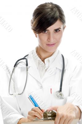 beautiful doctor posing with writing pad and pen
