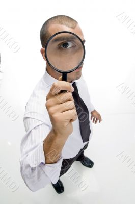 businessman looking through lens