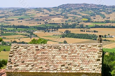 Landscape beyond a tiled roof
