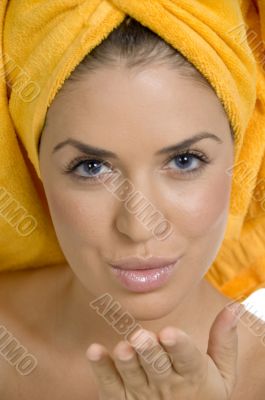 beautiful model in towel giving flying kiss