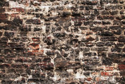 very rough wall with stones