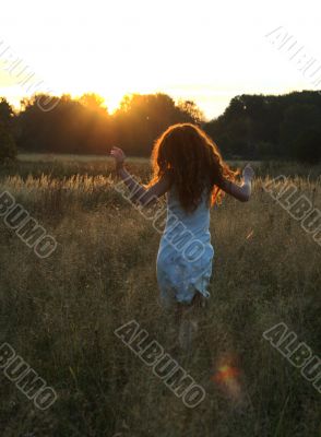 Girl running to the sun