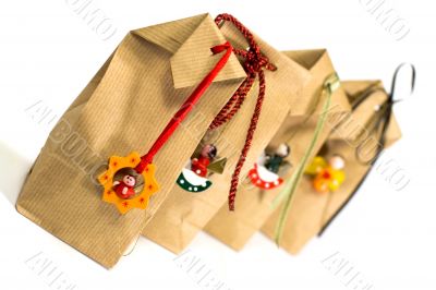 four brown gift bags